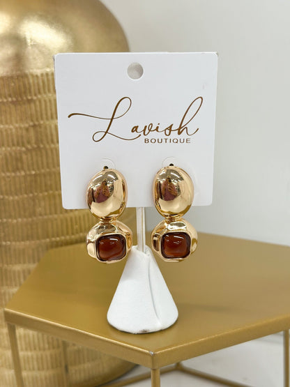 Statement earrings combining geometric stone shapes