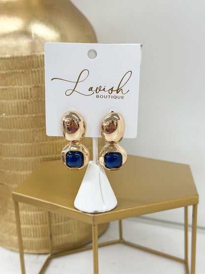 Gold-tone earrings with a raised dome stone