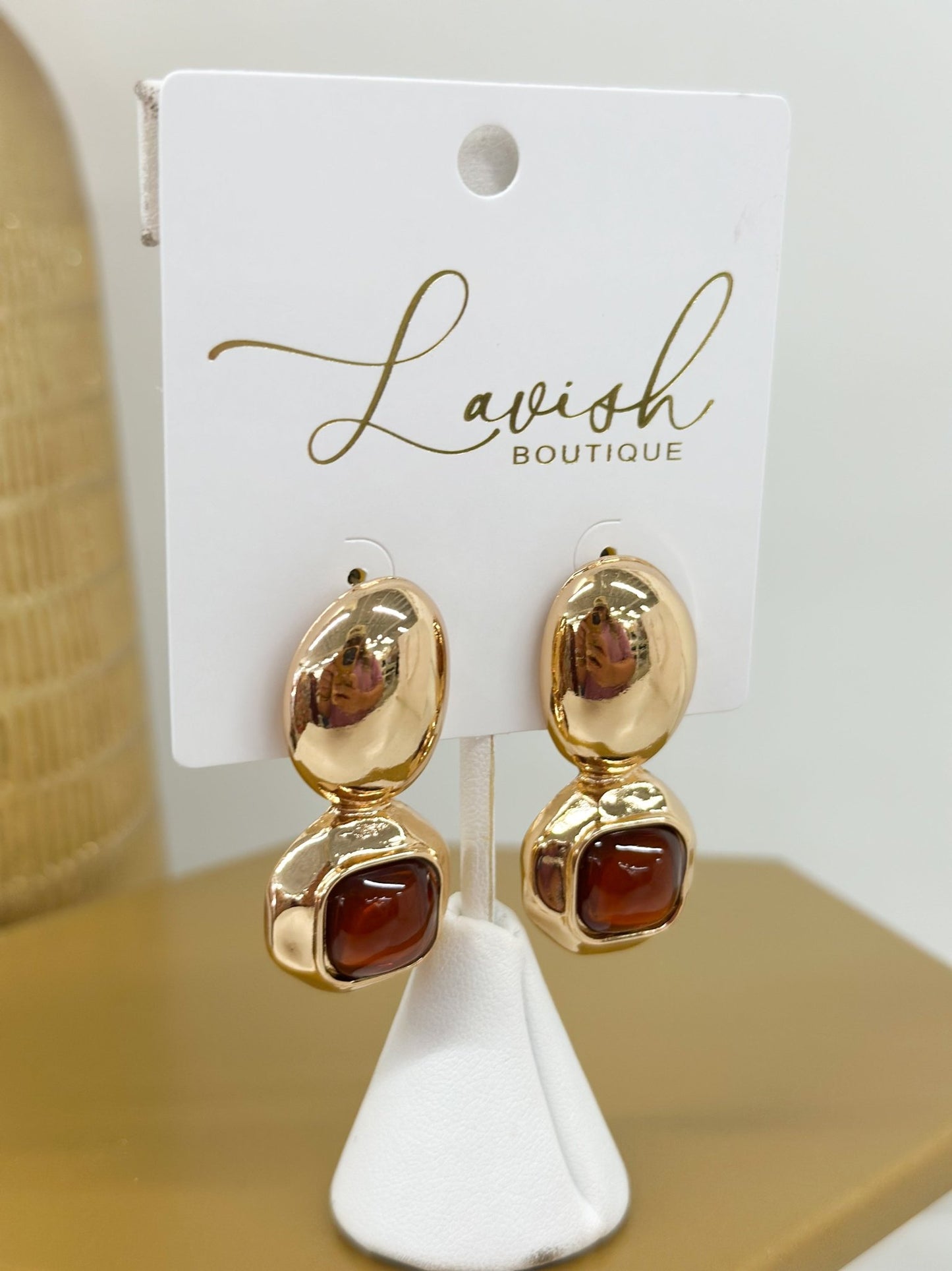 Dome stone earrings with an elongated oval below
