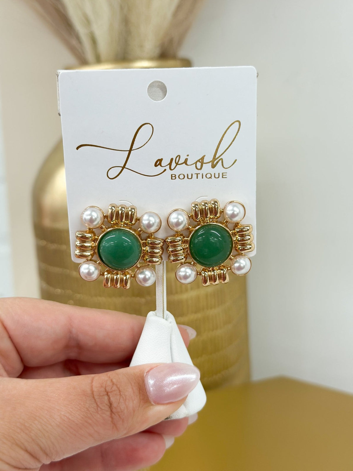 Earrings pairing a faceted stone with a pearl drop