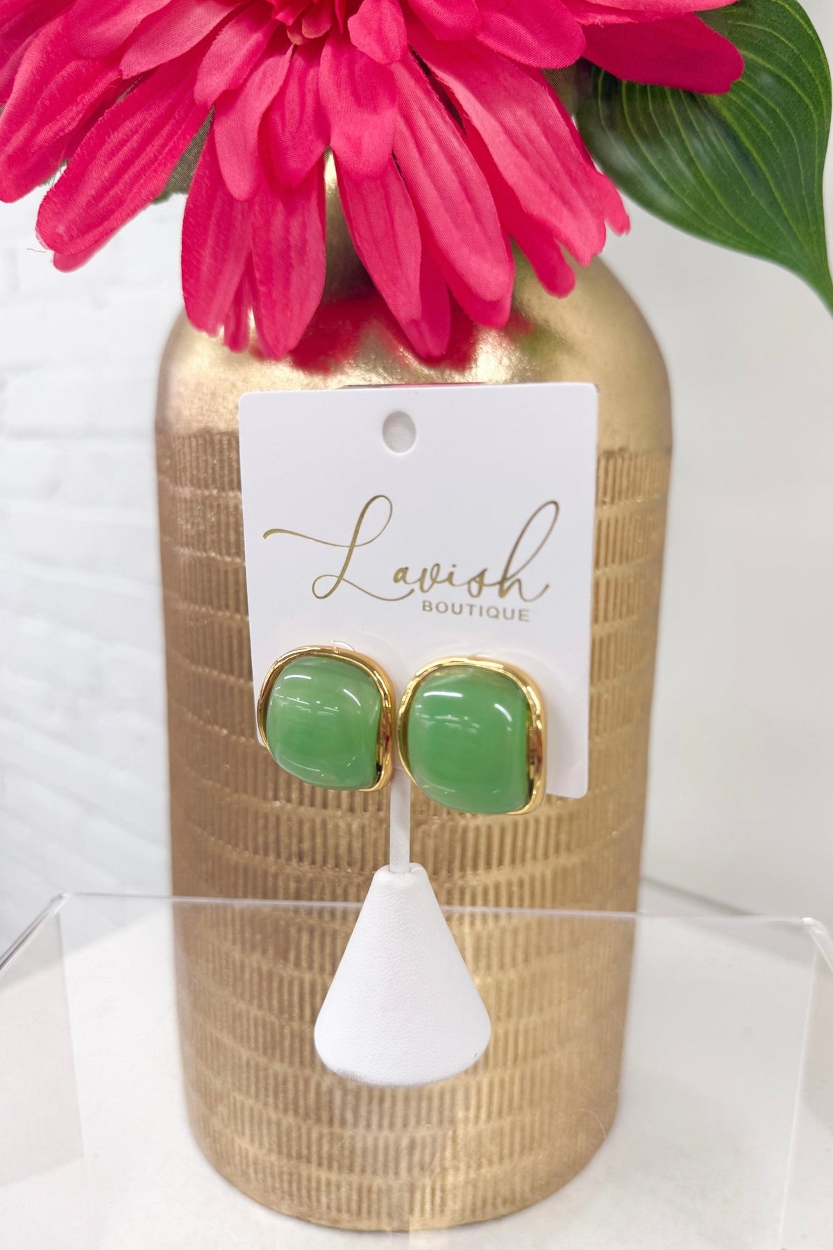 Starburst studs with a green center stone