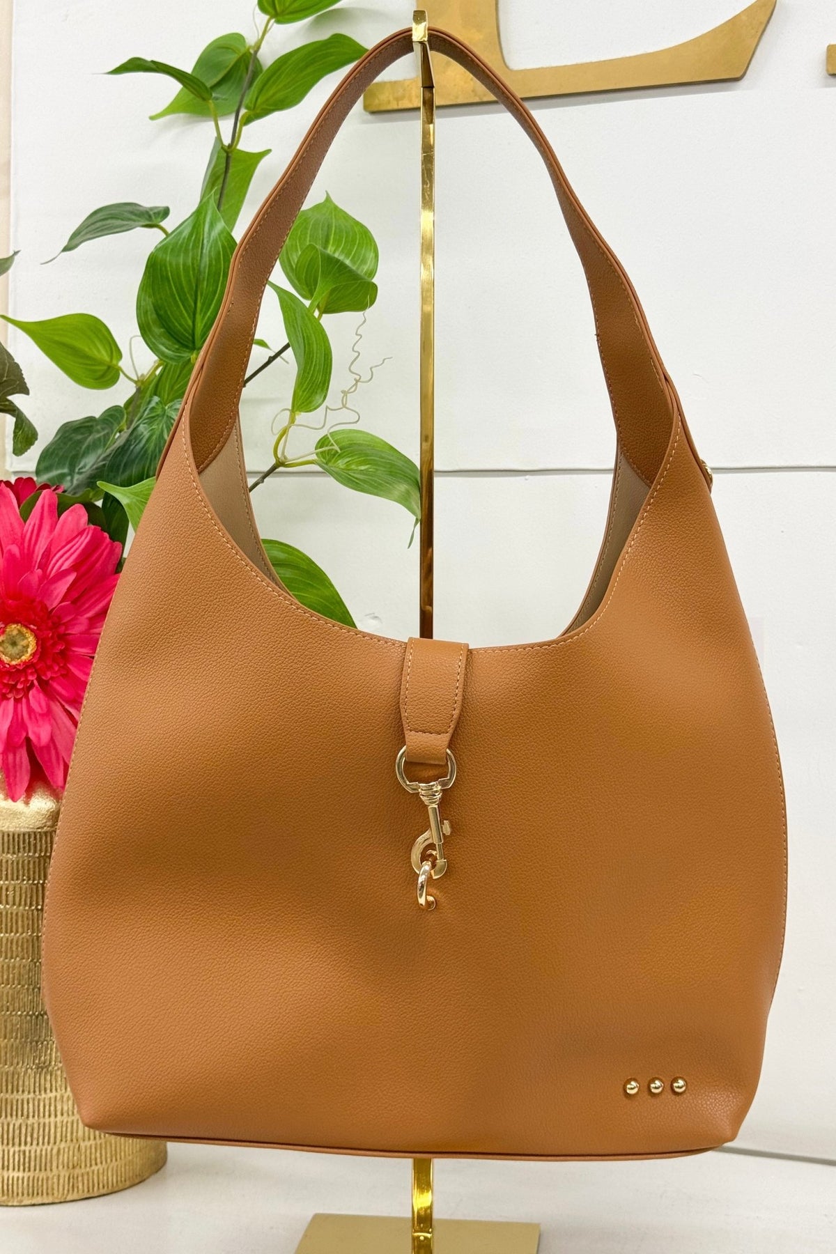Vegan leather hobo tote in brown with a slouchy shape