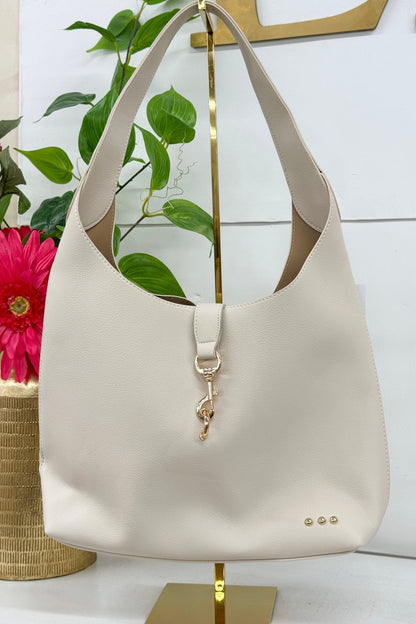Vegan leather hobo tote in cream with a slouchy shape