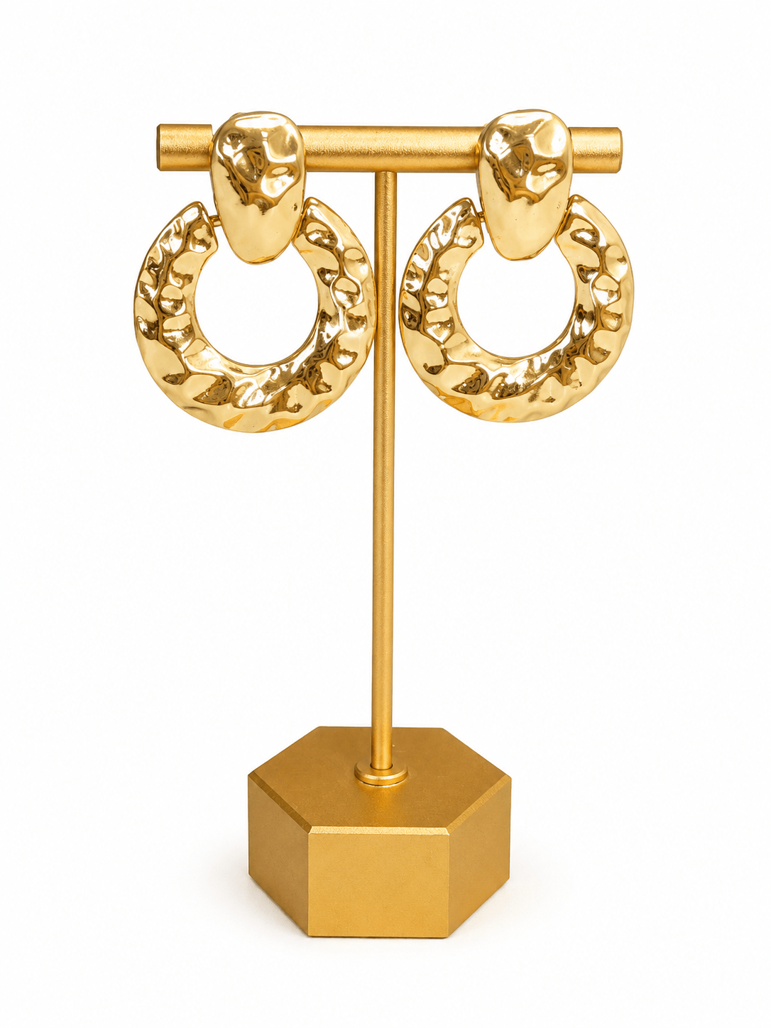 Door knocker style earrings with a hammered metal finish