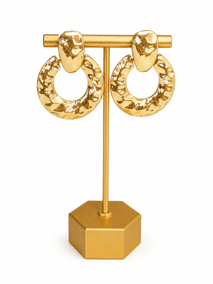 Door knocker style earrings with a hammered metal finish