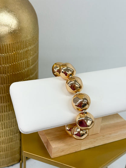 Chunky gold-tone ball bracelet with a hammered finish