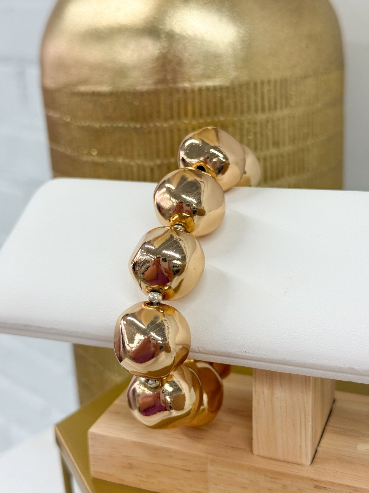 Oversized hammered metal beads on a bracelet