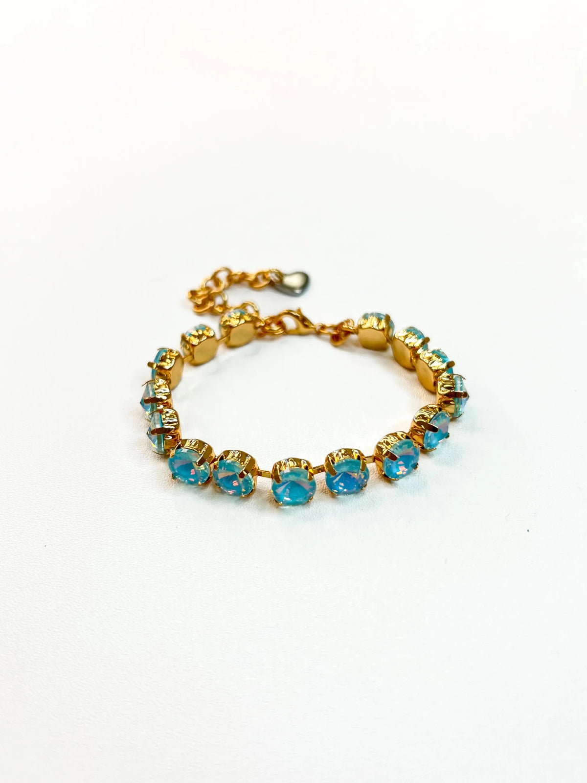 Tennis bracelet lined with pale iridescent stones