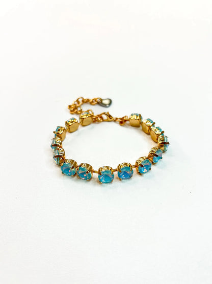 Tennis bracelet lined with pale iridescent stones