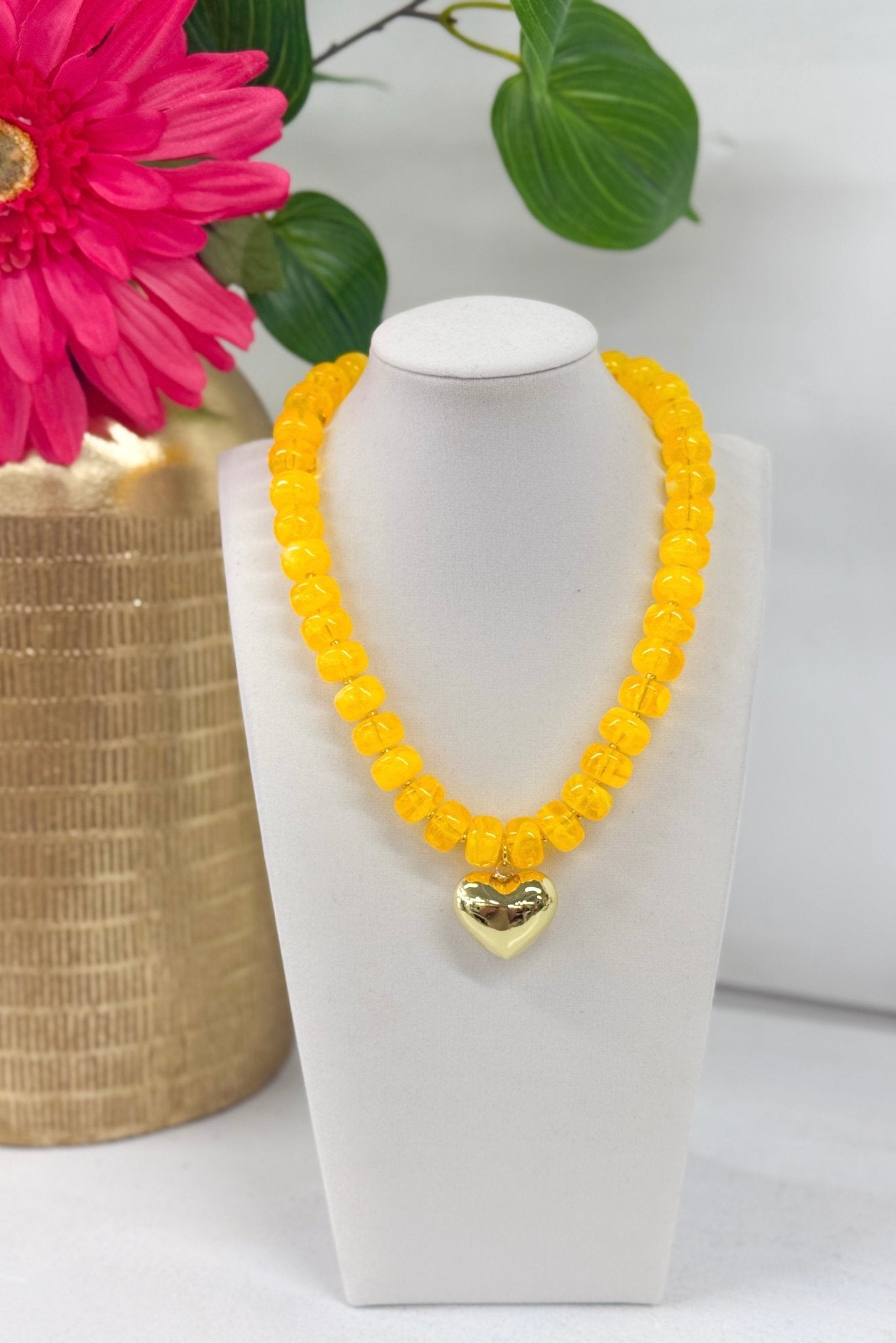 Marble beads strung with a gold heart pendant
