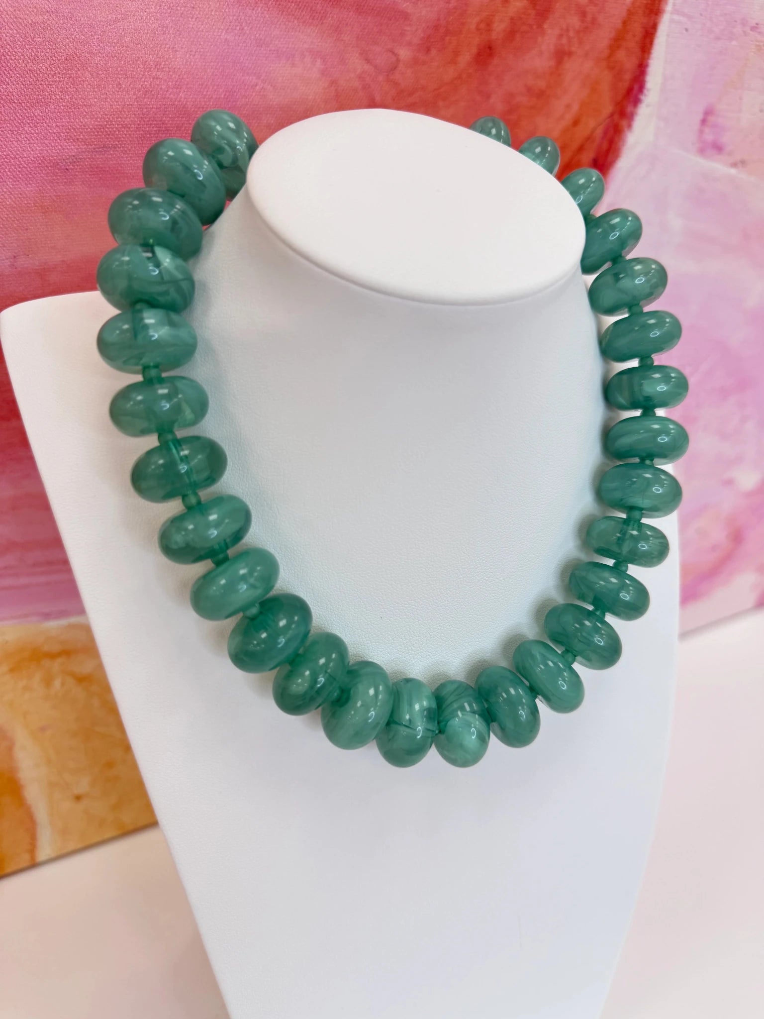 Marbled bead necklace in an elongated oval shape