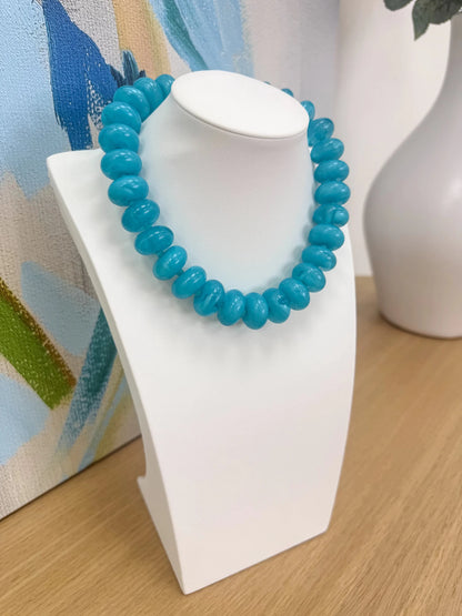 Necklace of oval beads with a swirled marble finish
