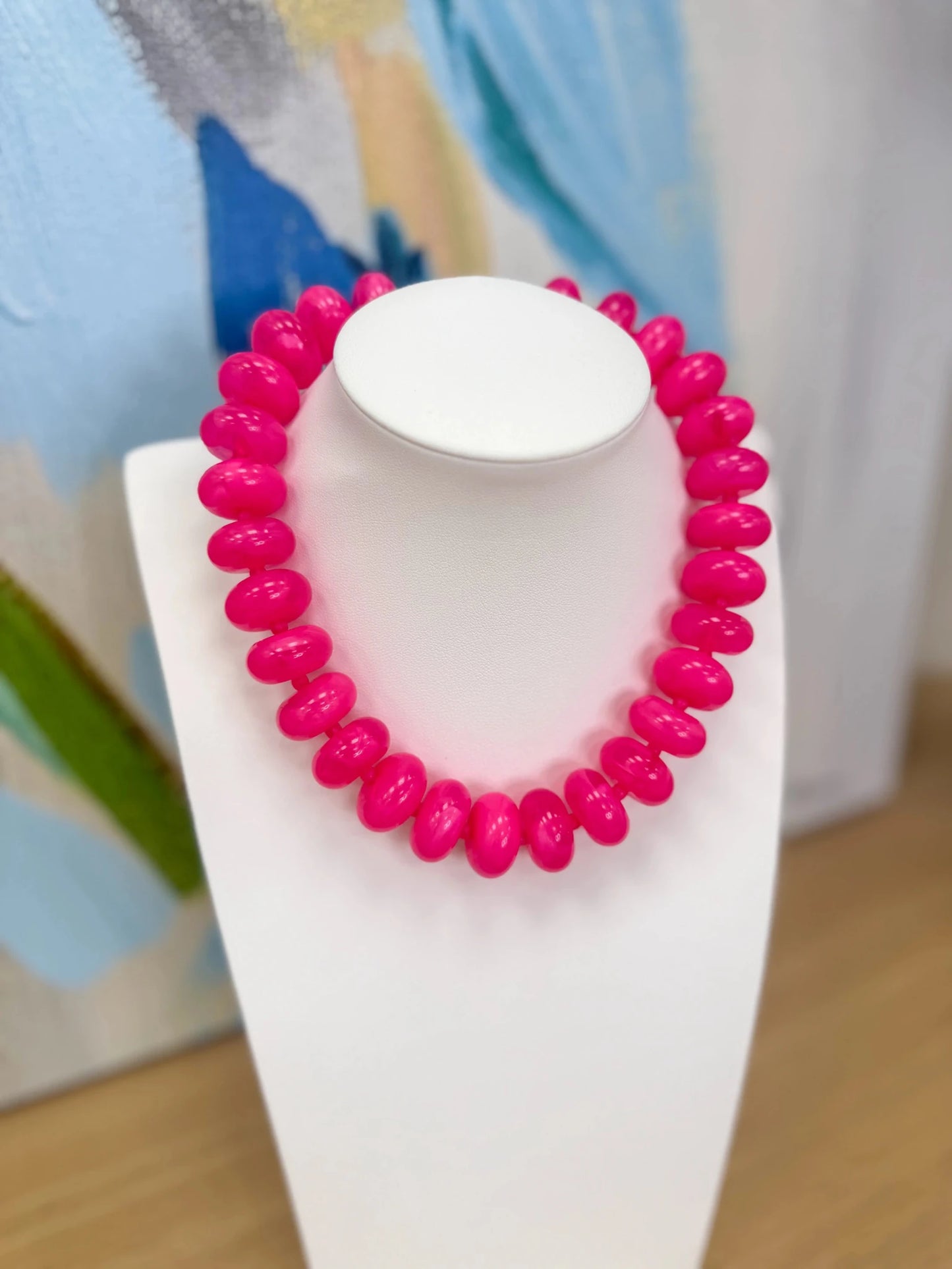 Necklace of glossy marbled oval beads