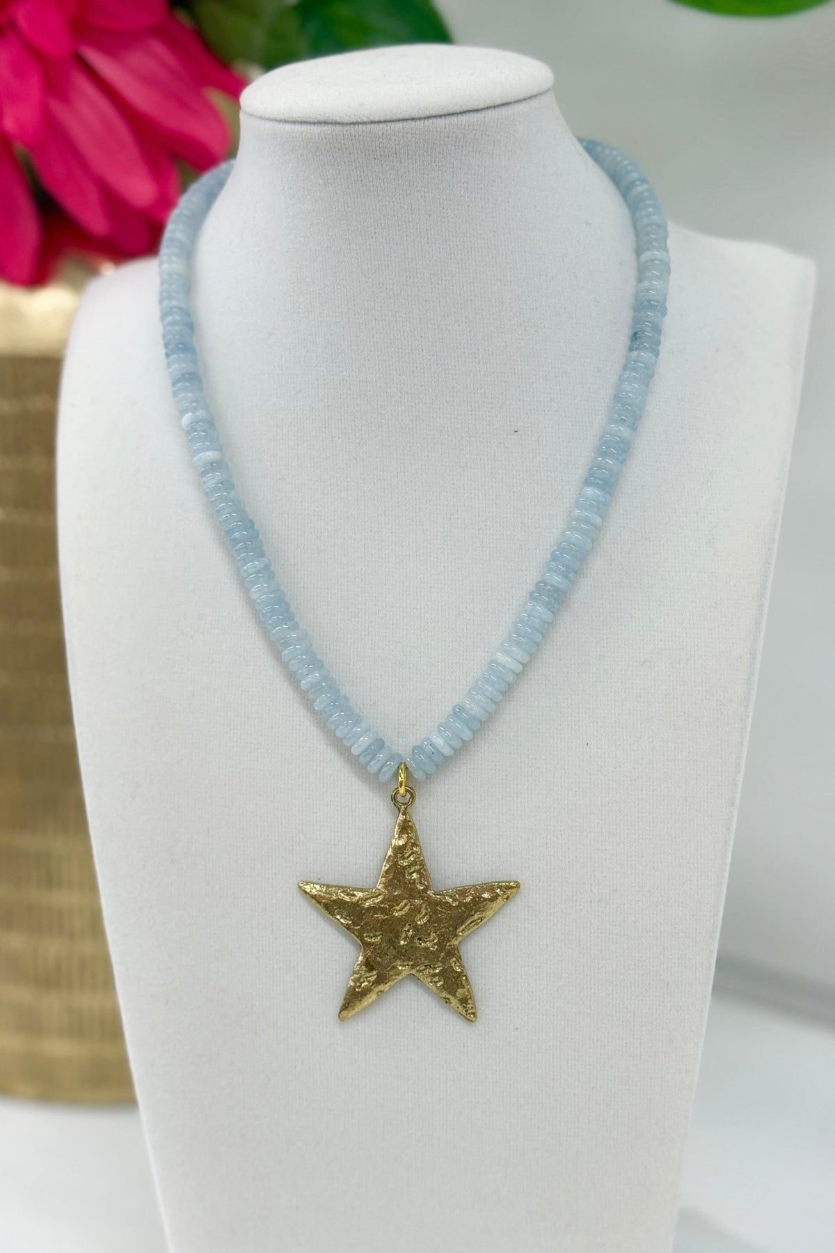 Small bead necklace with a gold star pendant