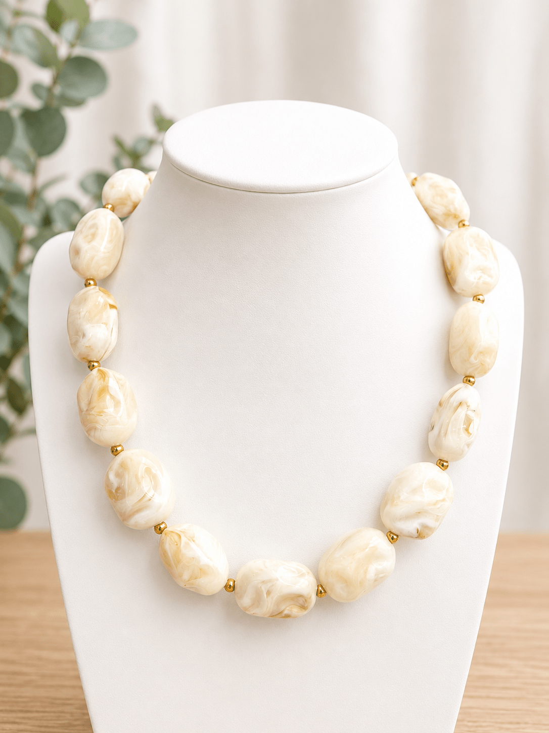 Square marbled beads strung into a cream necklace