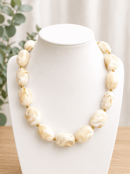 Square marbled beads strung into a cream necklace