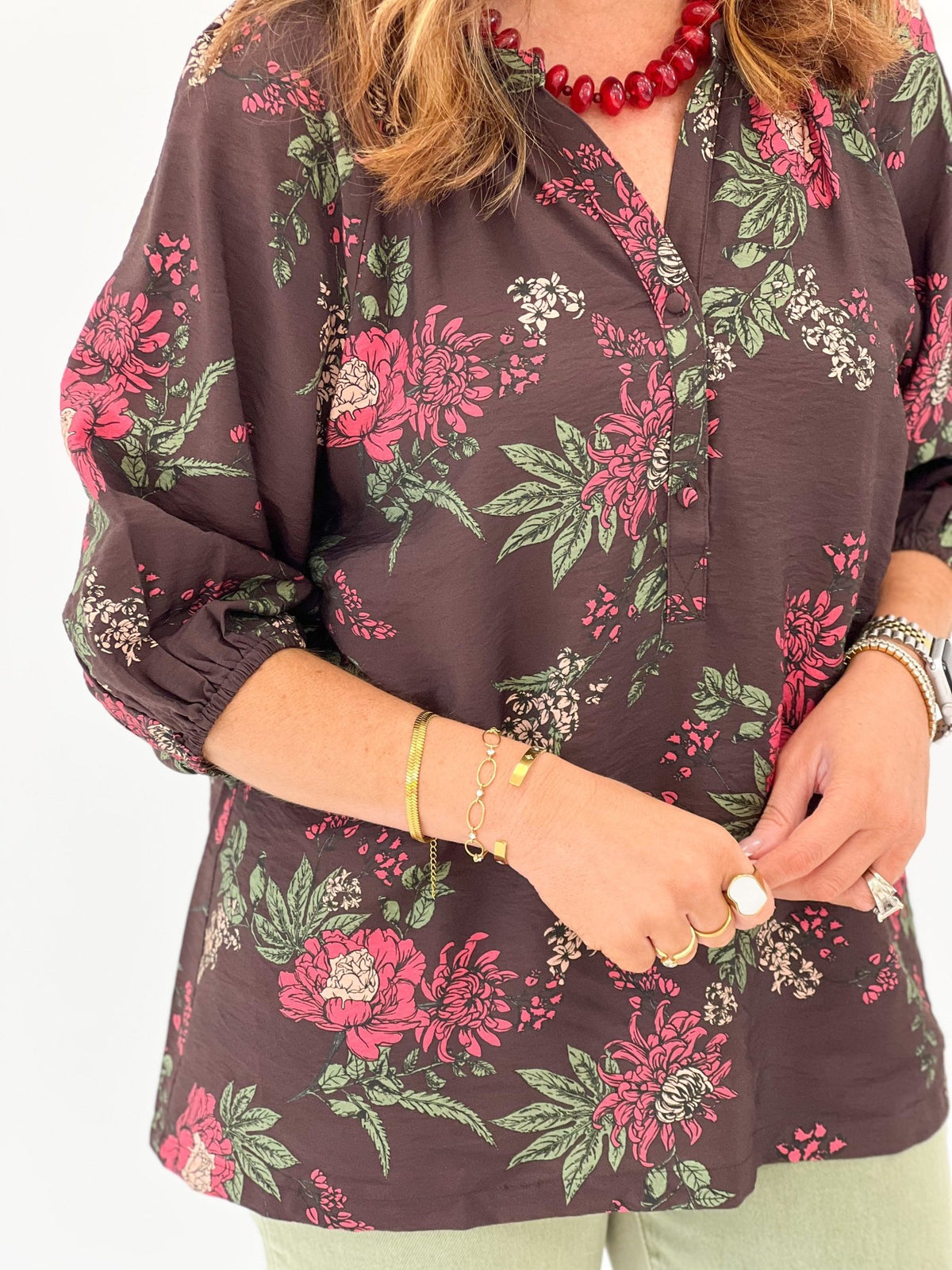 Brown floral blouse with a round neckline