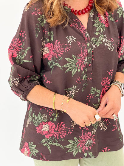 Brown floral blouse with a round neckline