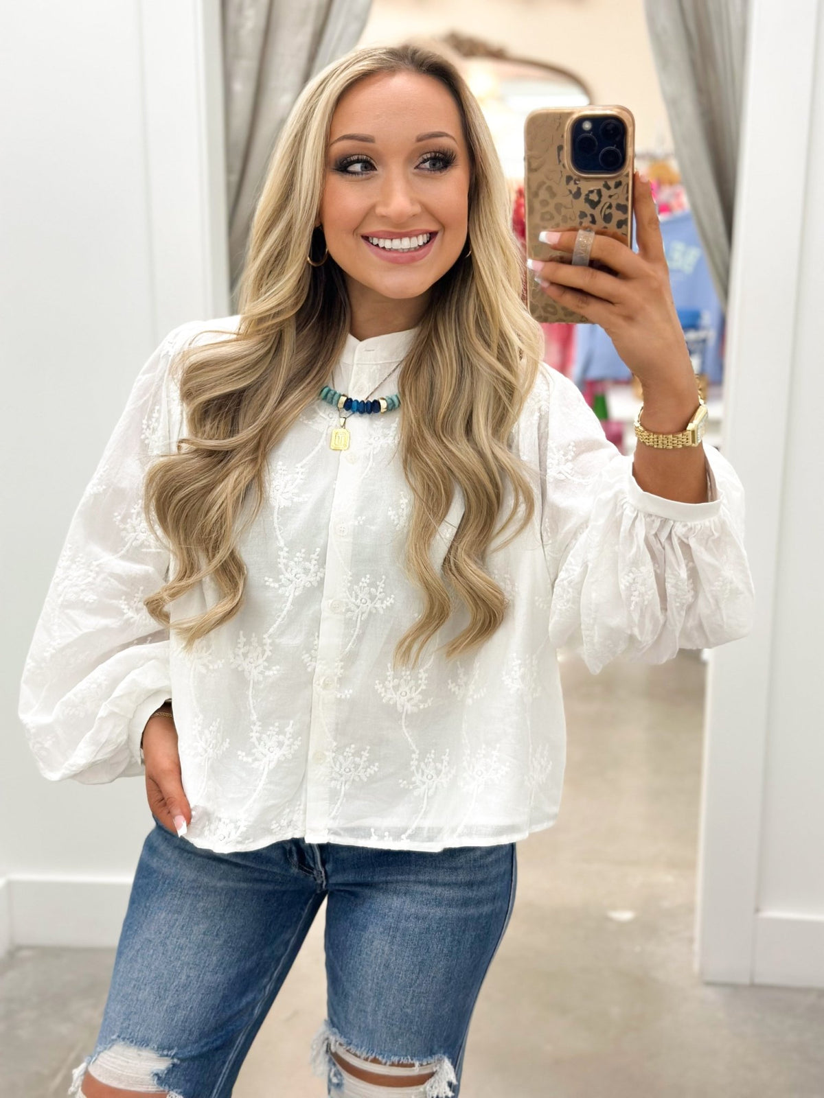 Long sleeve off white blouse with buttoned cuffs