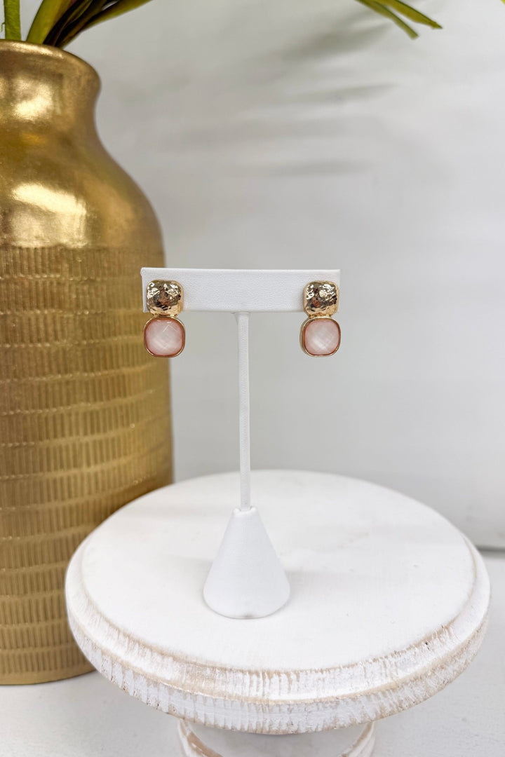 Ivory stone earrings with textured gold metal