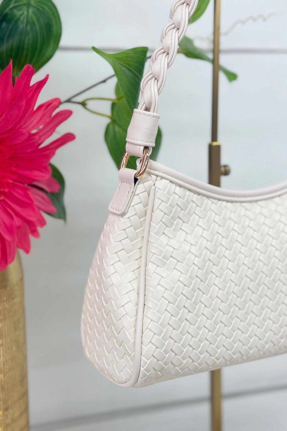Ivory woven handbag with a braided top handle