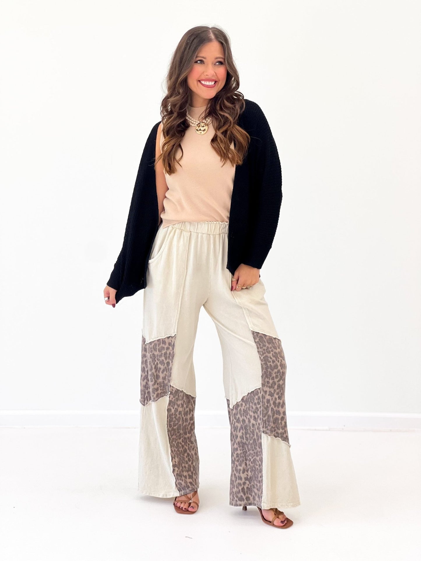 Cream wide-leg pants with leopard print side panels and elastic waist, patchwork
