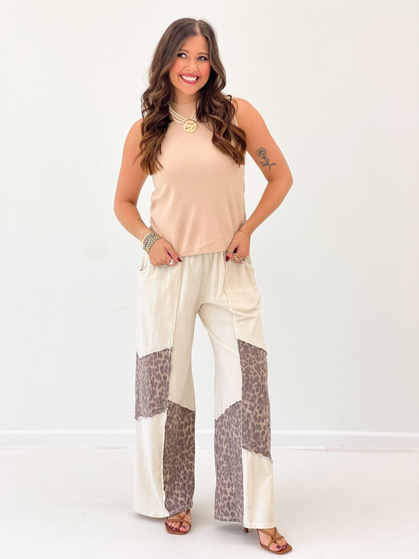 Cream wide-leg pants with leopard print panels, elastic waist and patchwork detail