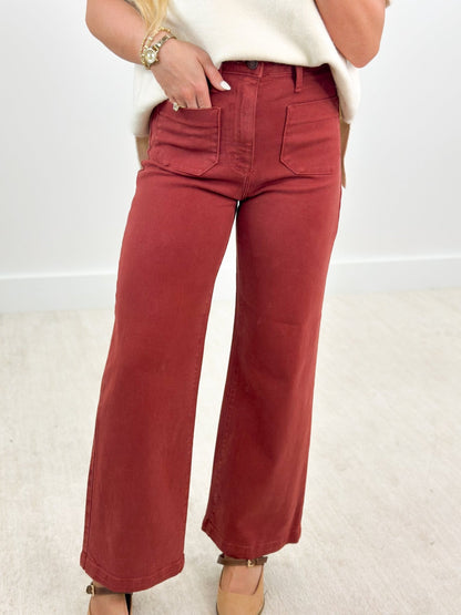 Dark burgundy wide leg jeans with patch pockets
