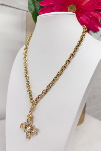 Gold cross necklace set with clear stones