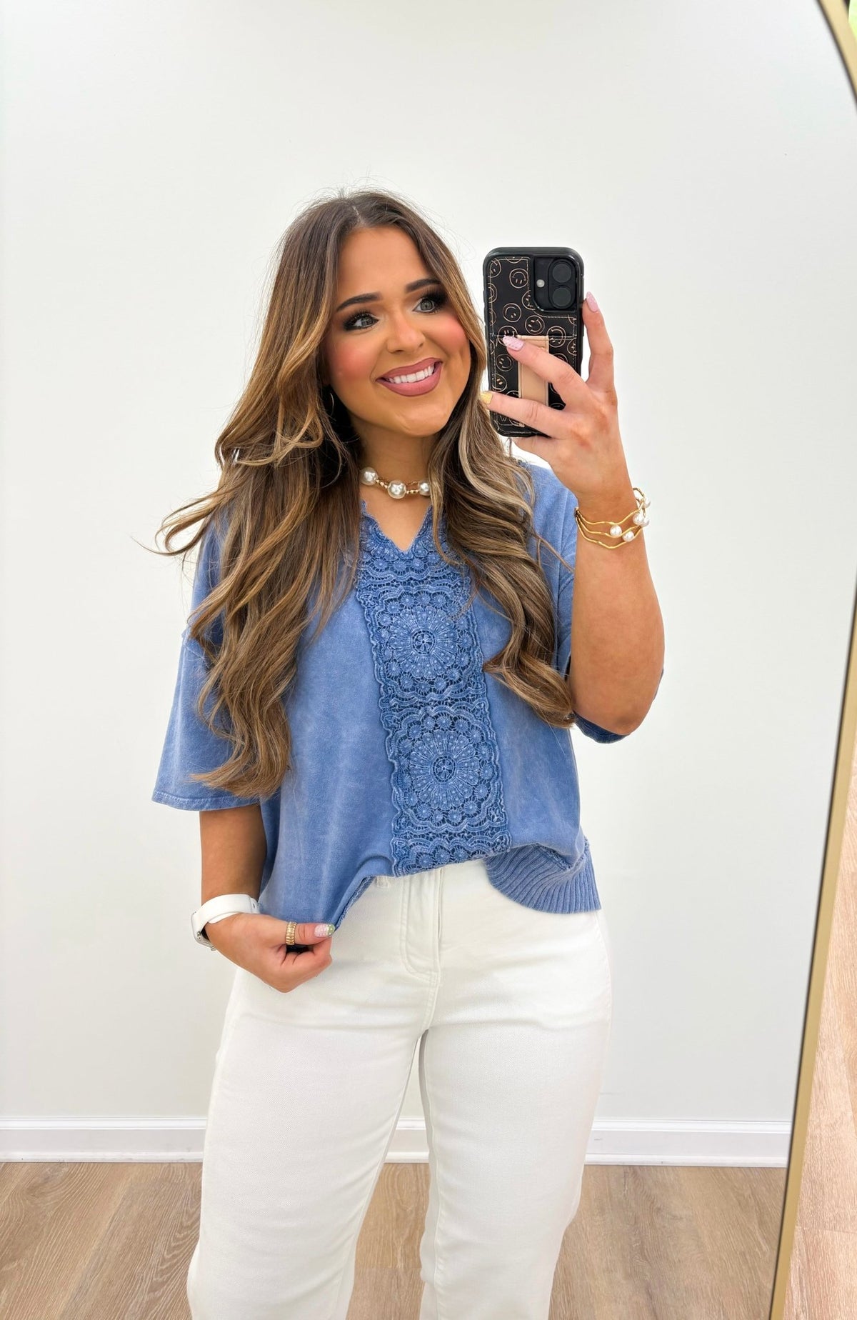 Denim blue v-neck top with a faded wash finish