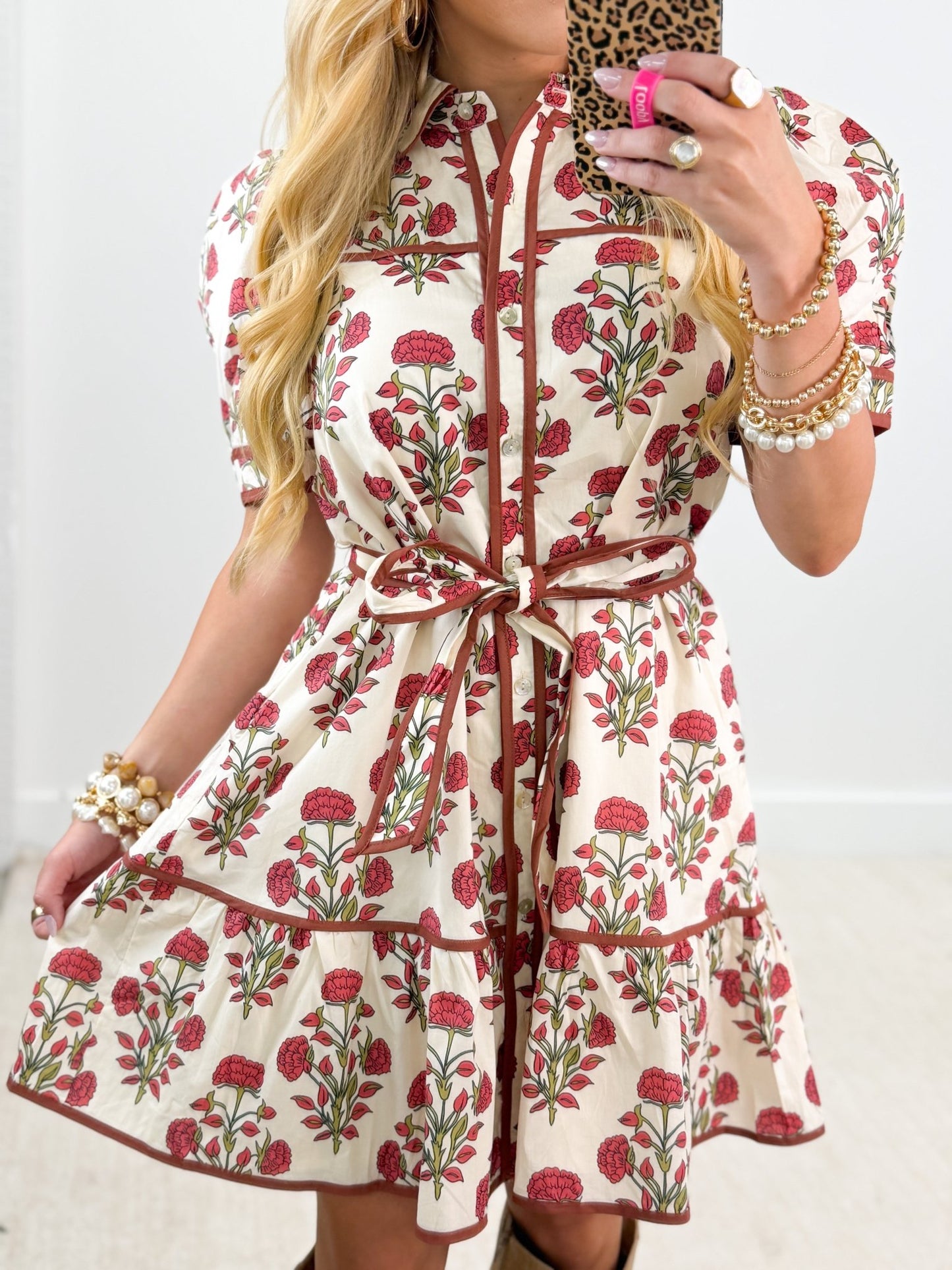 Button placket on an ivory flower detail dress