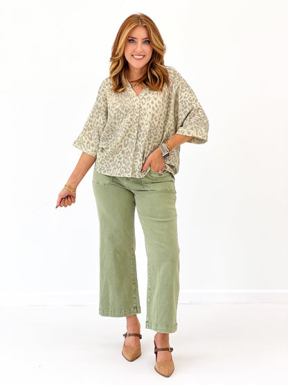 Dusty sage leopard print button-up blouse with half sleeves and front button placket
