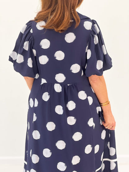 Smocked dress with a flowing midi skirt