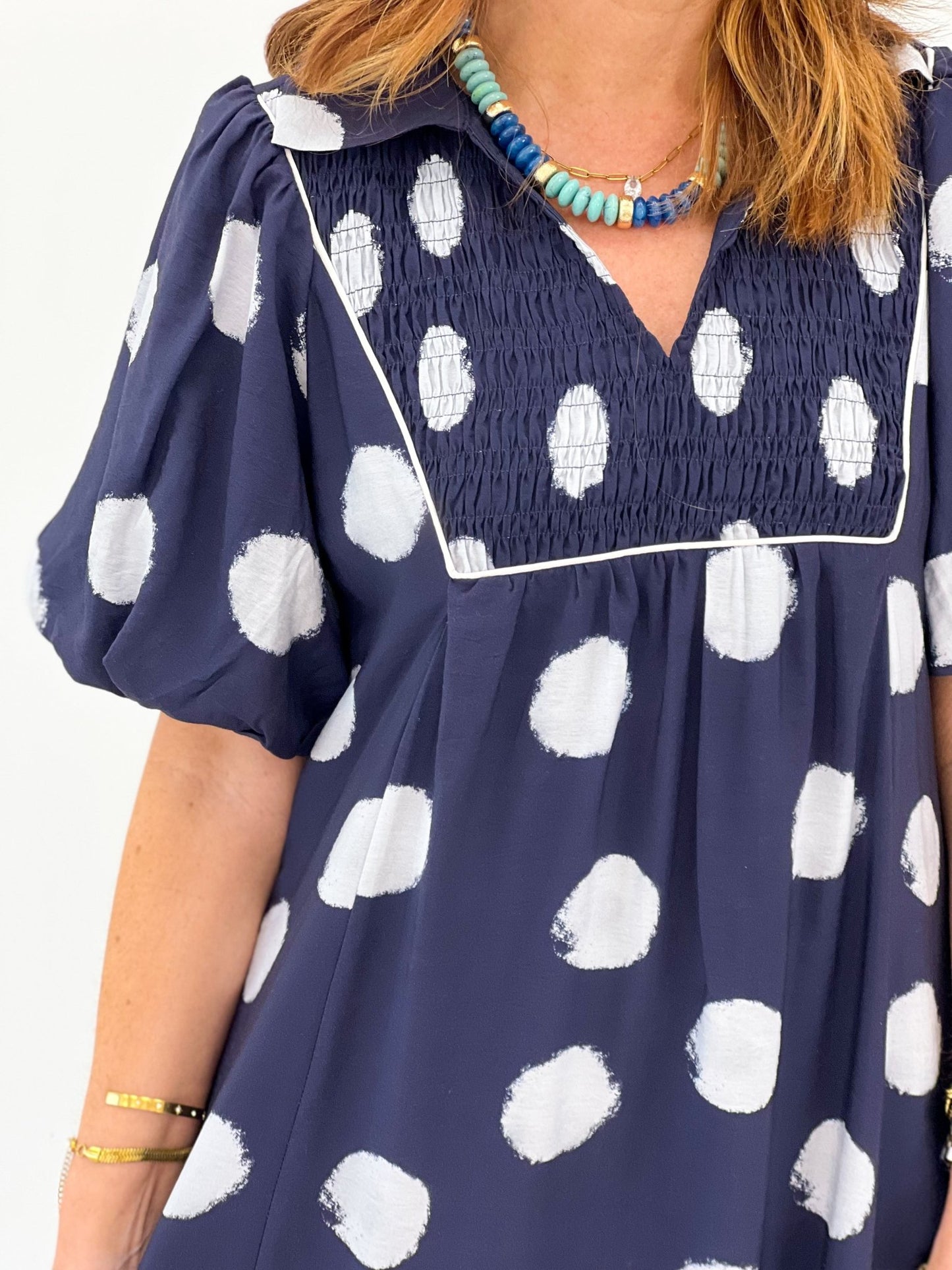 Detail of the smocked bodice on a midi dress