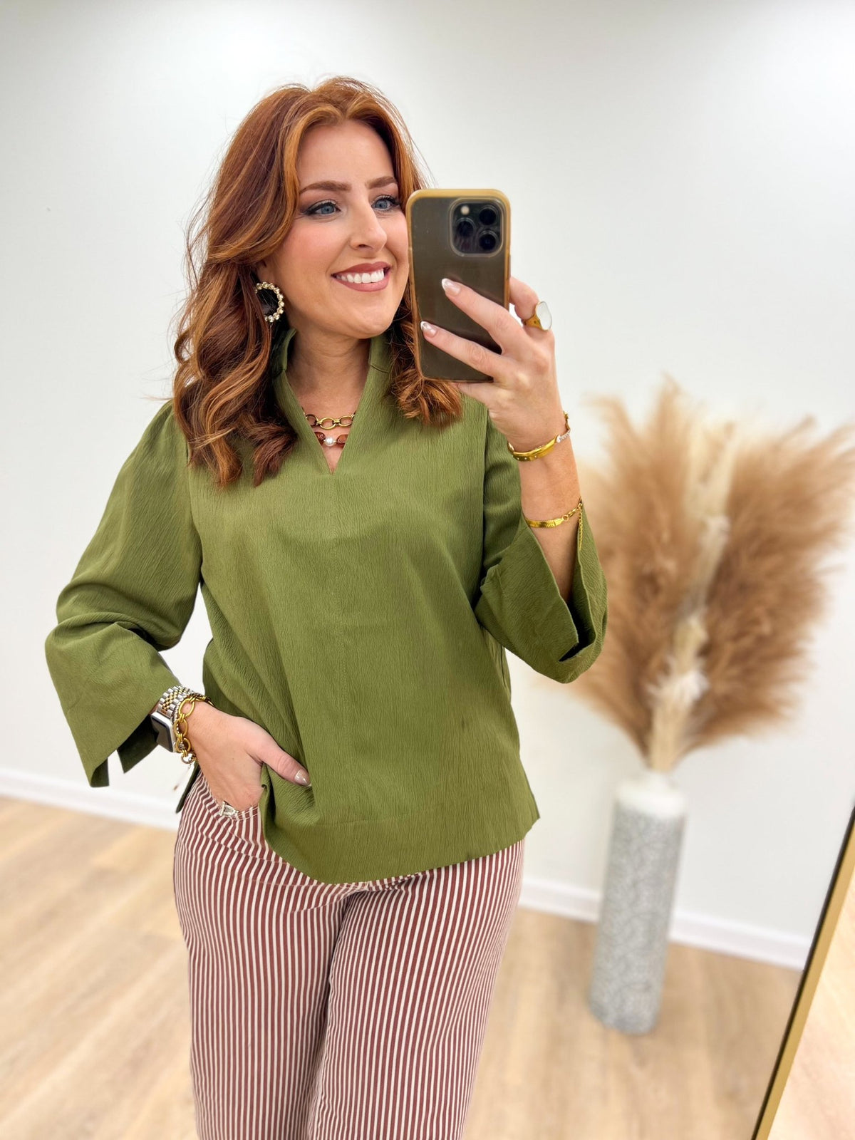 Soft green v-neck top with a textured weave
