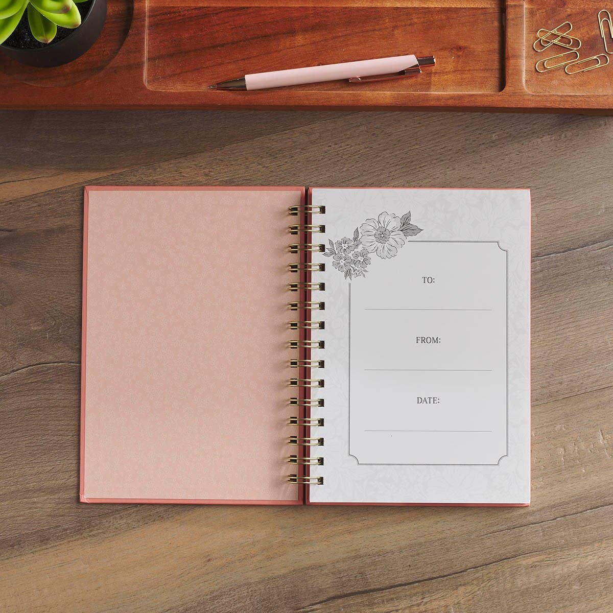 Pink floral scripture journal with a spiral binding