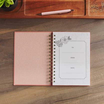 Pink floral scripture journal with a spiral binding