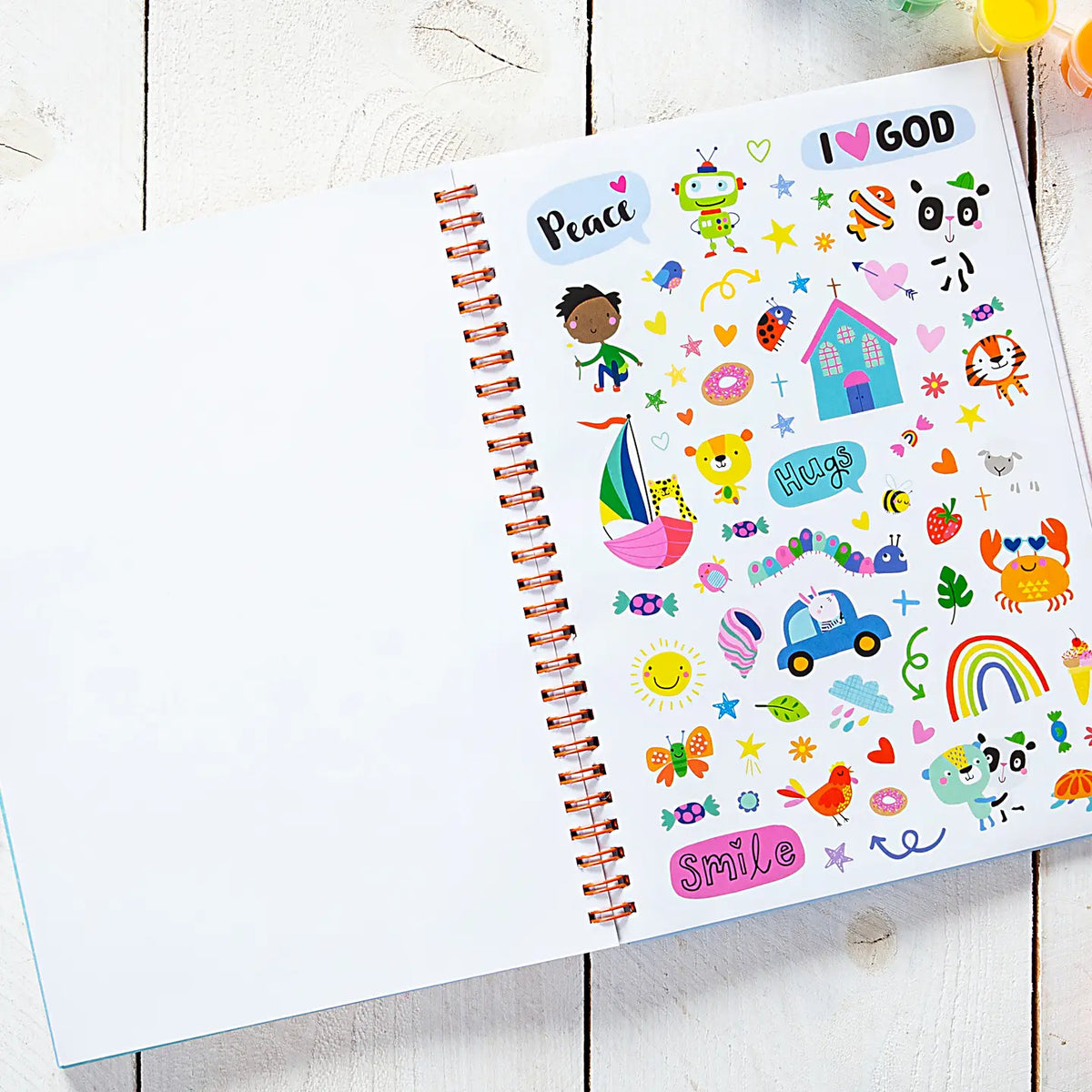 Kids spiral notebook journal open to peace and smile colorful sticker style page