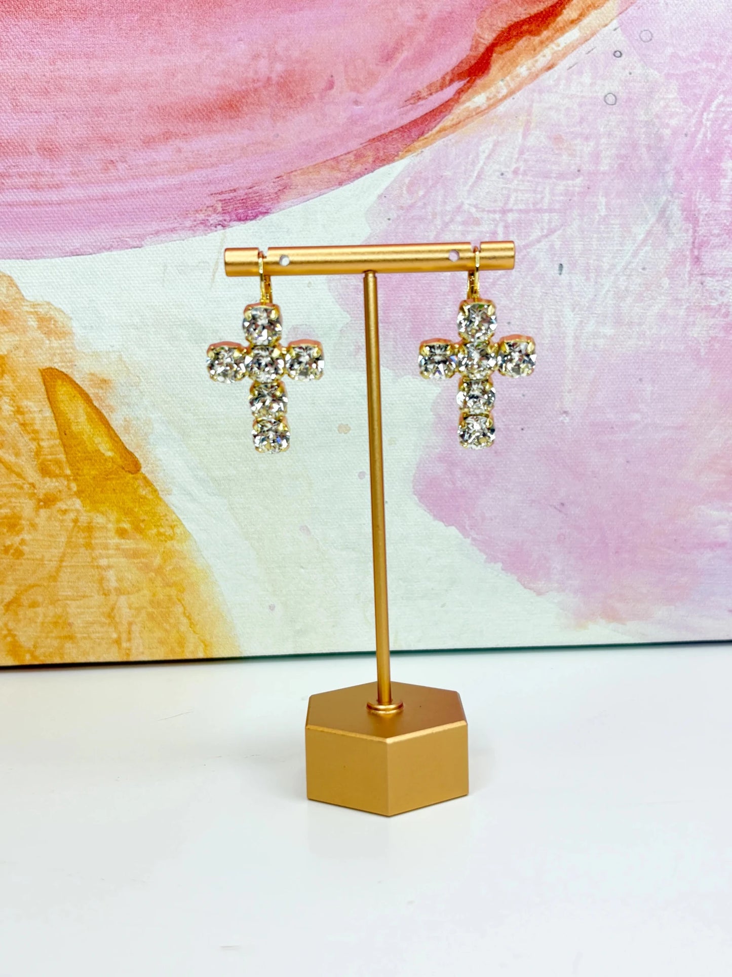 Cross shaped earrings lined with crystals