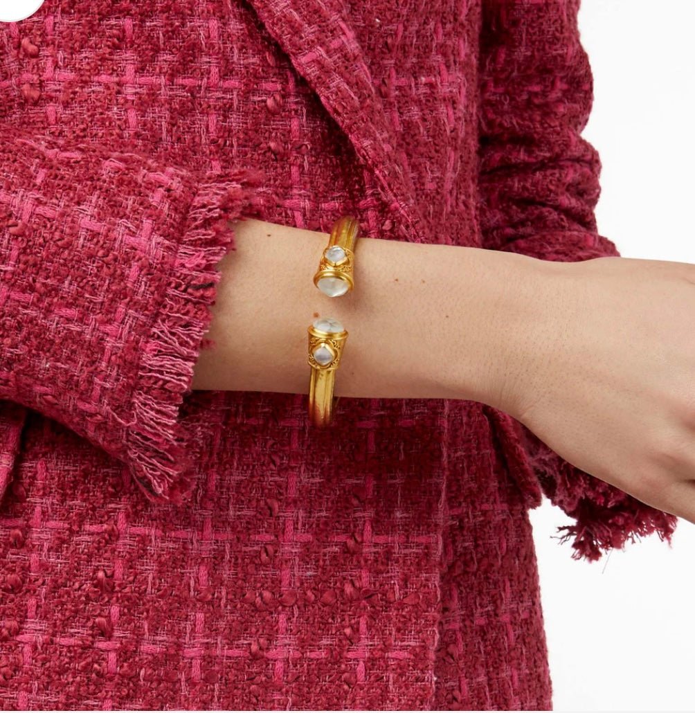 Iridescent crystal set into a gold demi cuff