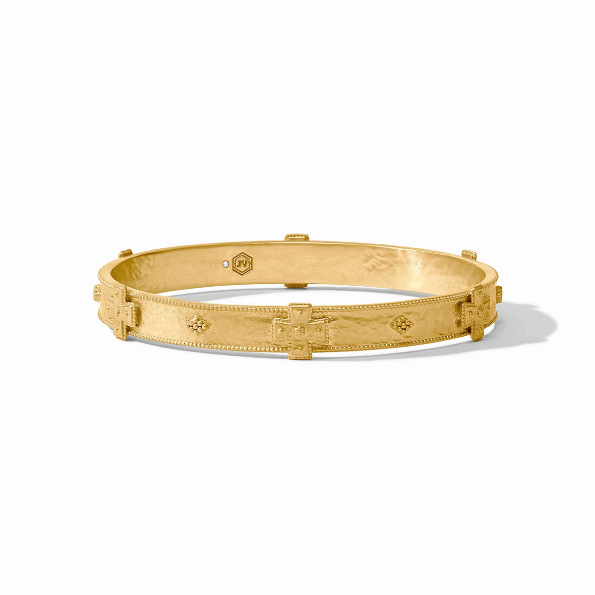 Gold bangle bracelet with an ornate finish