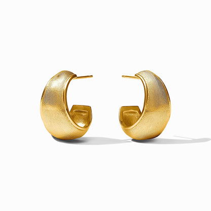 Wide gold hoops with a raised cobblestone surface