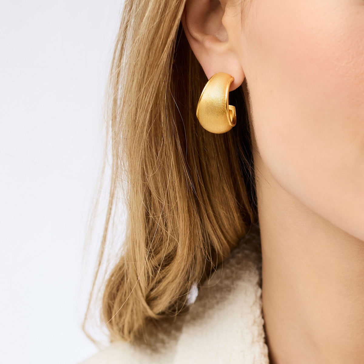 Gold cobblestone-textured statement hoop earrings