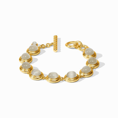 Gold tennis bracelet lined with ivory cat's eye stones