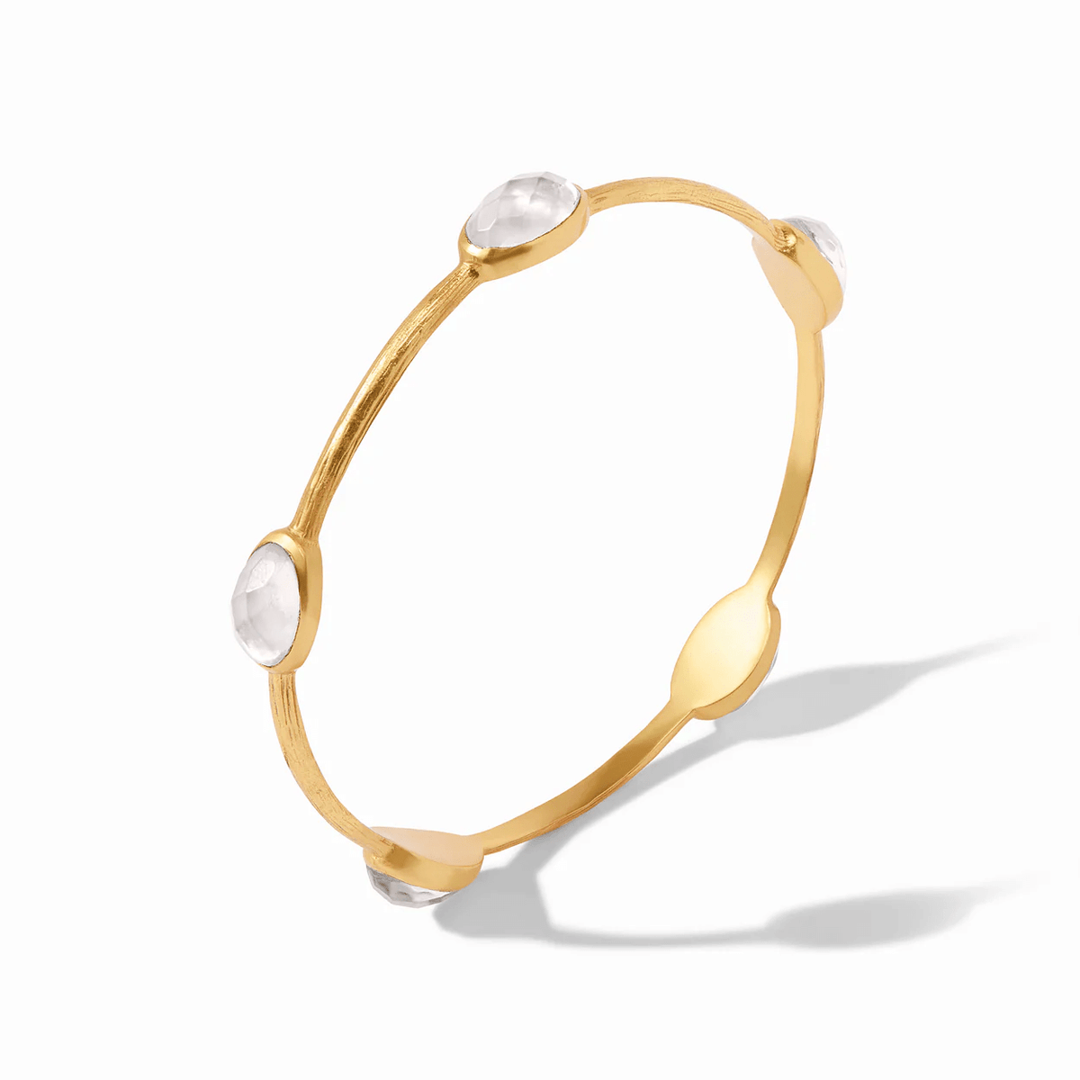 Iridescent crystal set into a gold stone bangle