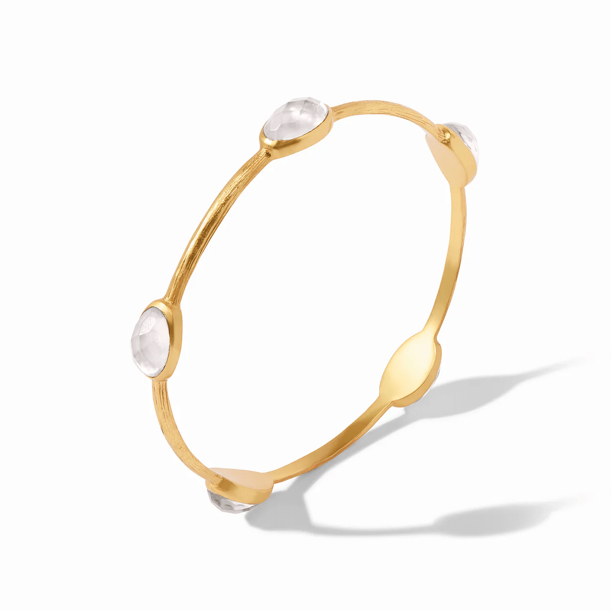 Iridescent crystal set into a gold stone bangle