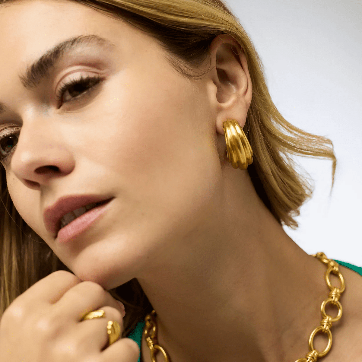 Oversized gold hoops with a textured band