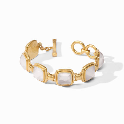 Gold bracelet centered on a faceted iridescent crystal