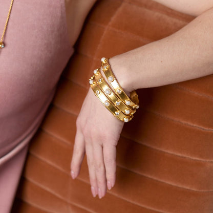 Pearl-accented gold bangle bracelet