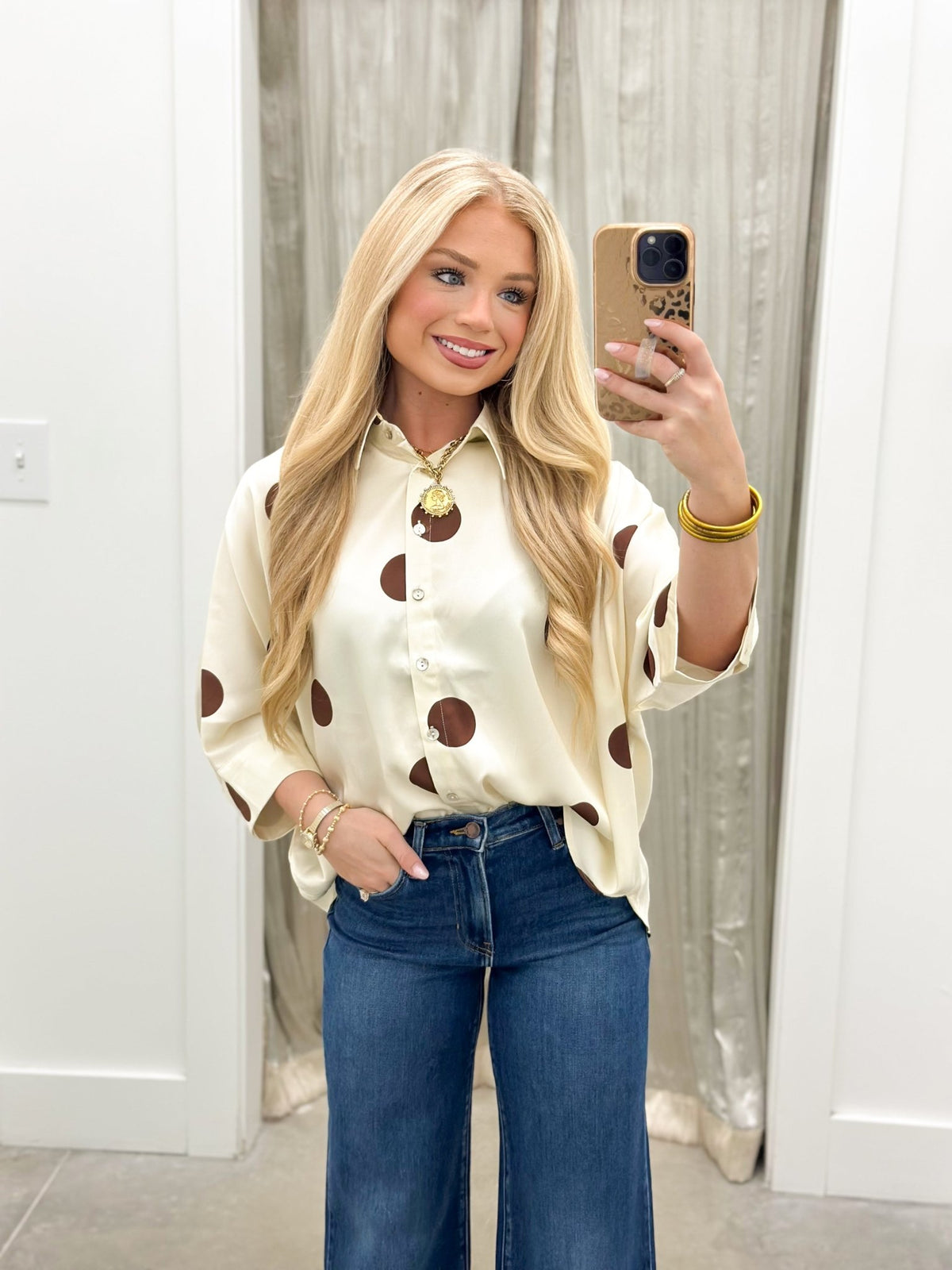 Dark wash wide leg jeans with a button and zip front